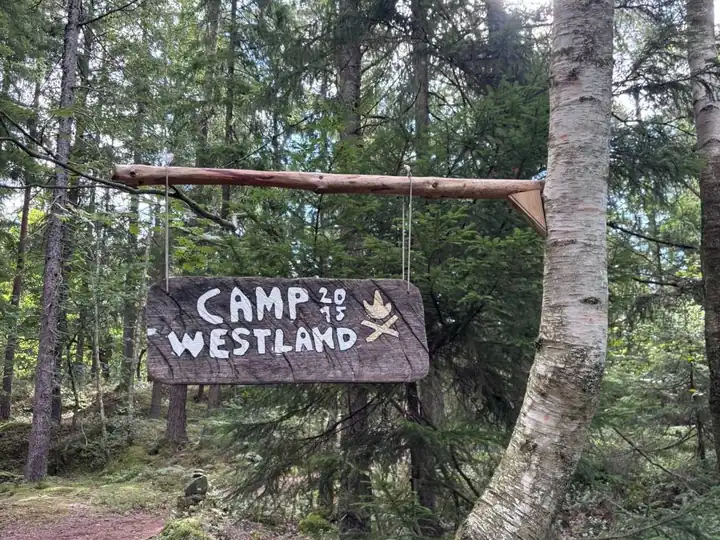 The Camp Westland sign on the path