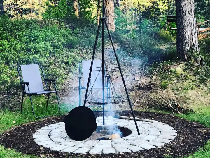 Fire pit with the tripod and pot