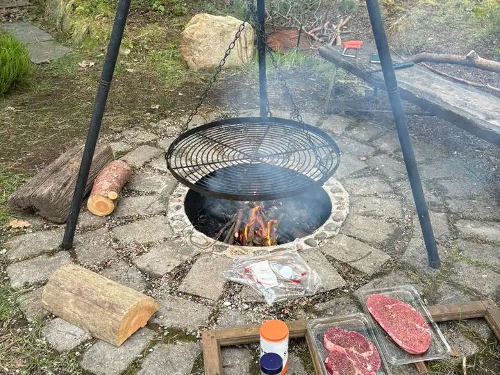 Steaks ready for the grill over the fire pit