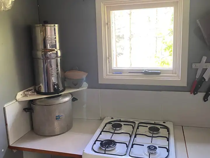 The gas stove with the water filter beside it