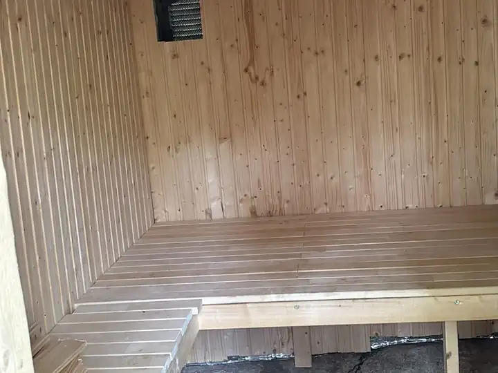 Inside the sauna: the wooden benches